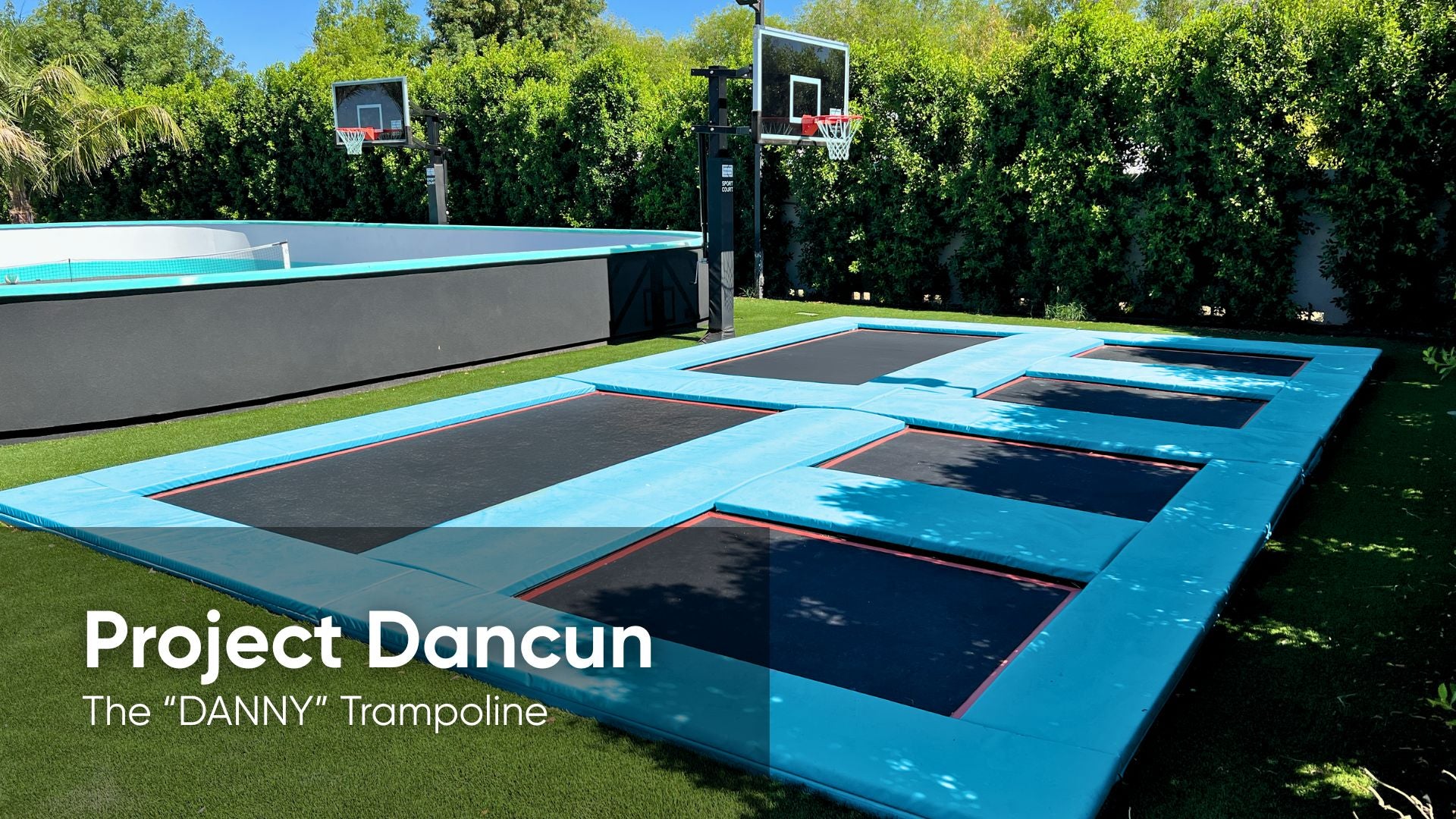 In-ground trampoline in a backyard with basketball hoops and greenery.